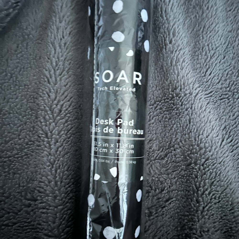 Black and white polkadot desk pad tech elevated brand is soar